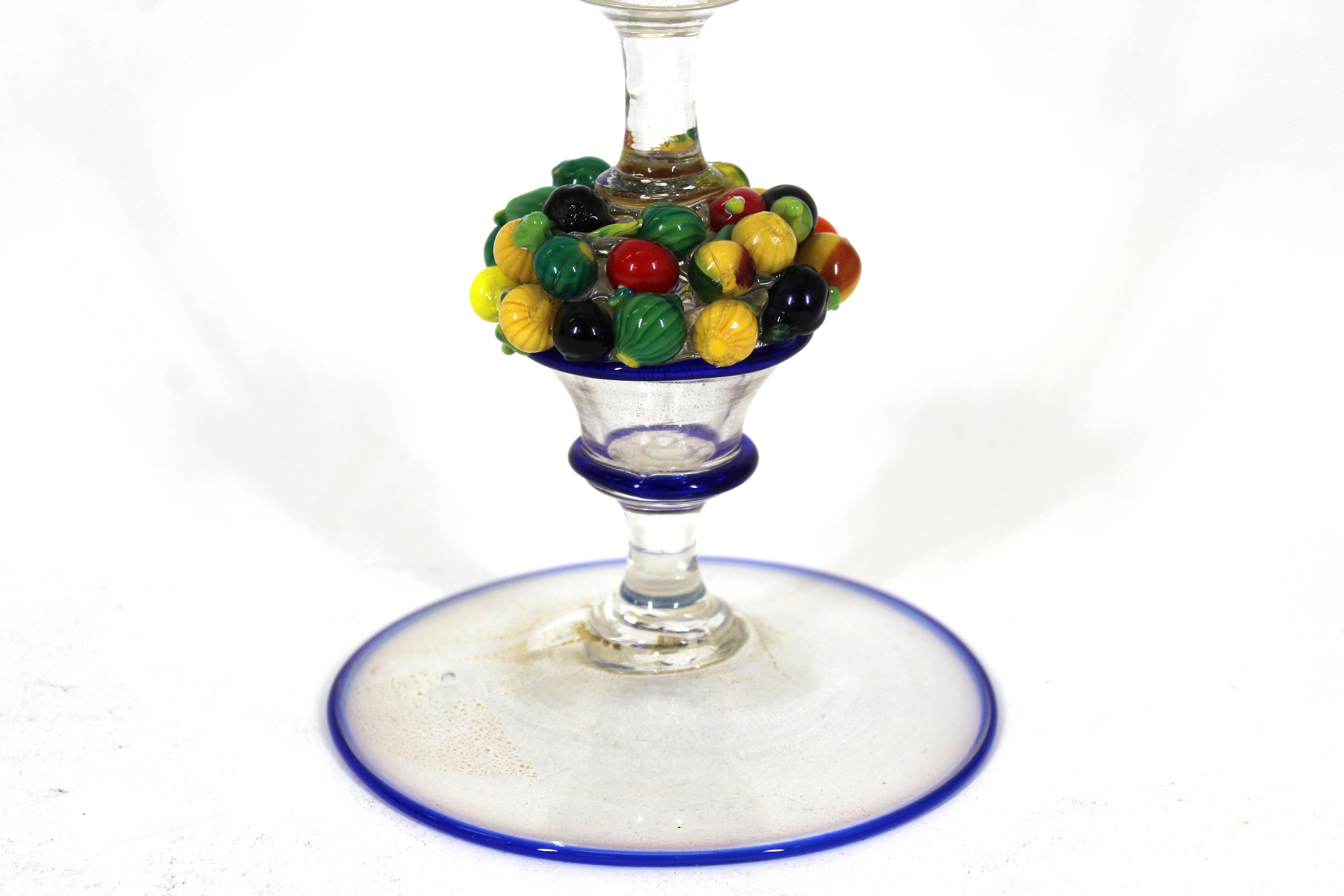 Napoleone Martinuzzi Italian Art Deco period Murano art glass goblet in clear glass with gold powder inclusions and cobalt blue trim and sculpted glass fruit basket stem. Made during the 1920's-1930's in Italy. In great antique condition with