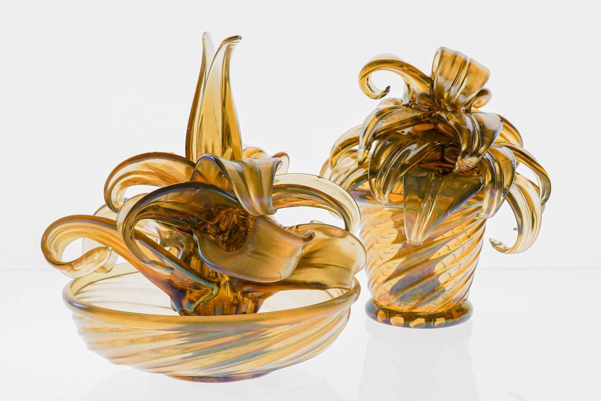 Tare pair of two glass cactus in an iridescent Fume finish. This design is a classic design by Napoleone Martinuzzi.
Update: One leaf on the large cactus snapped and was glued in place. New price reflects this.
Napoleone Martinuzzi's career included