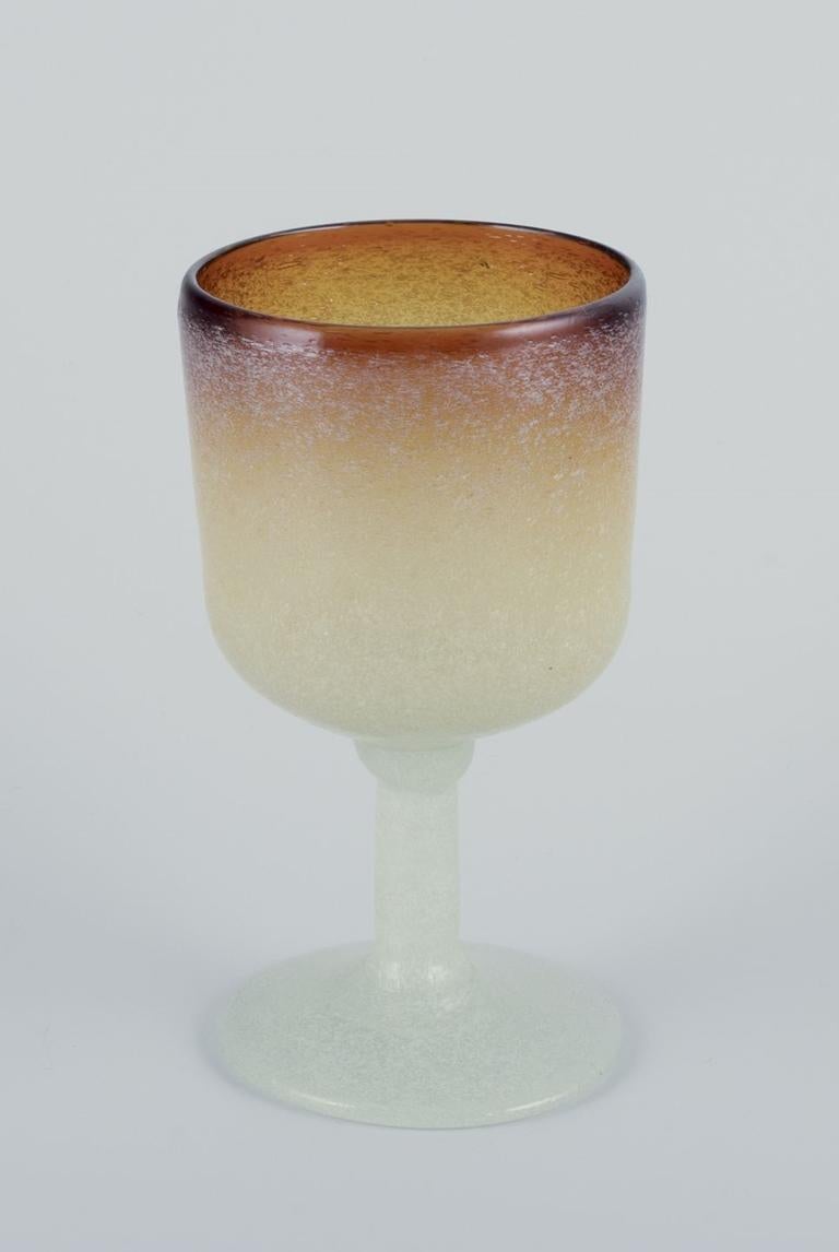Pre-owned goods are exempt from import duties for U.S. customers. 
Therefore, no import tariffs will be applicable to your purchase.

Napoleone Martinuzzi, Venini, Murano.
A set of five red wine glasses in art glass. Mouth-blown, with bubbles in the