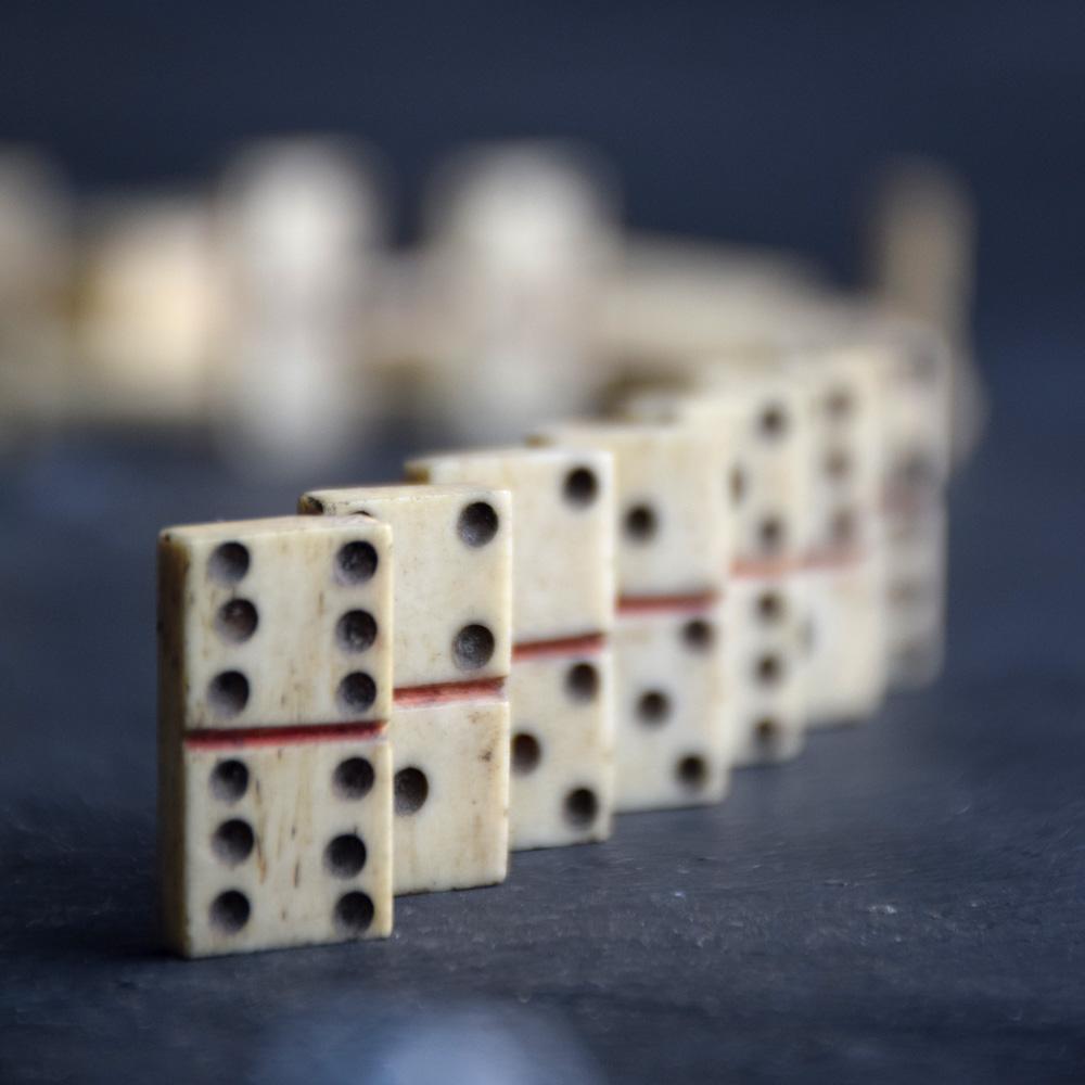 Napoleonic Prisoner of war bone and wood Domino game 
We are proud to offer a most unusual and rare early 19th century Napoleonic Prisoner of War bone and wood Domino game, with its original box and lid taking the shape of a piece of French Empire