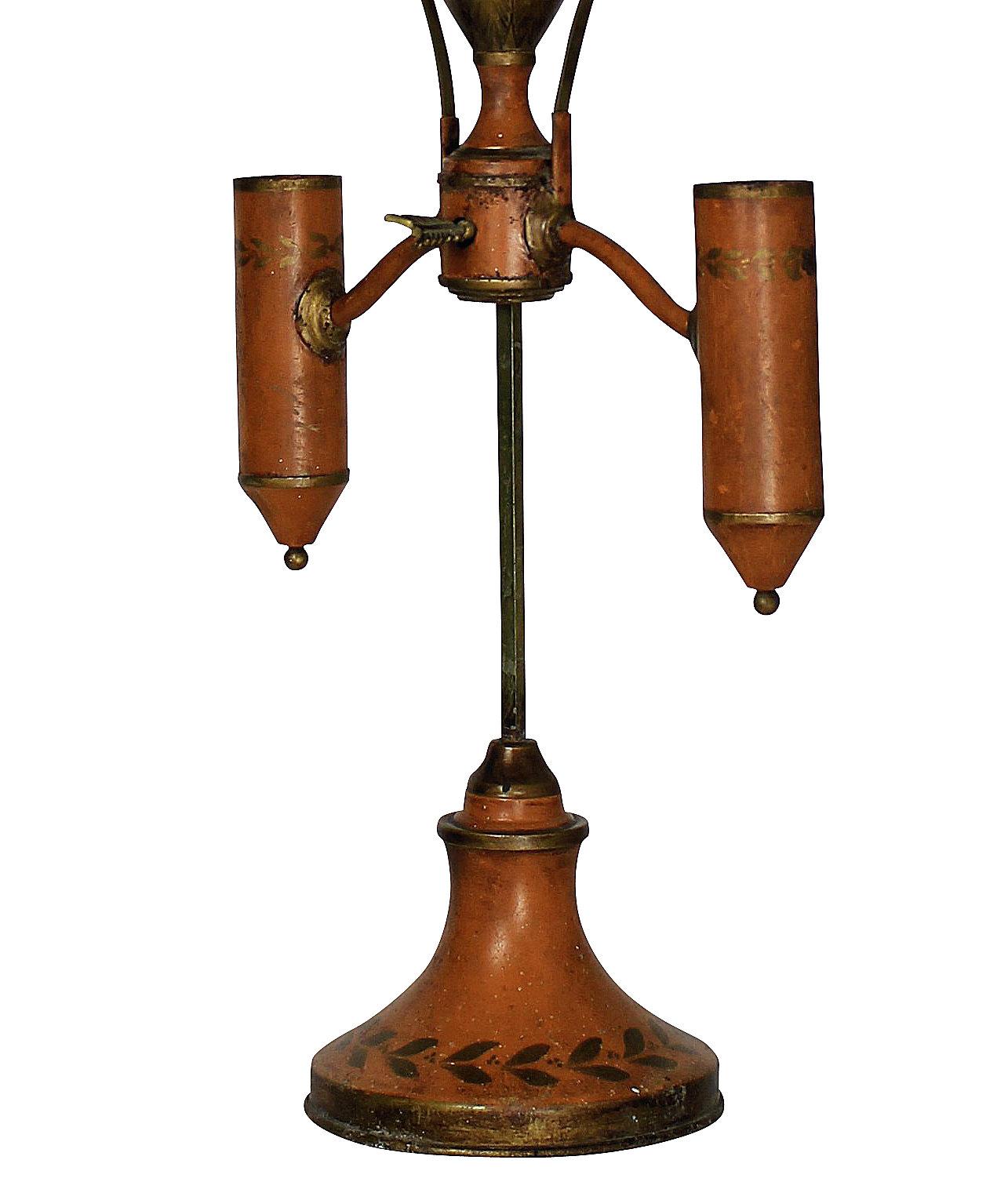 A French Napoleon III hand painted tole desk lamp in orange and gold leaf, with adjustable brass shades. In the Napoleonic revival style, depicting bees.

