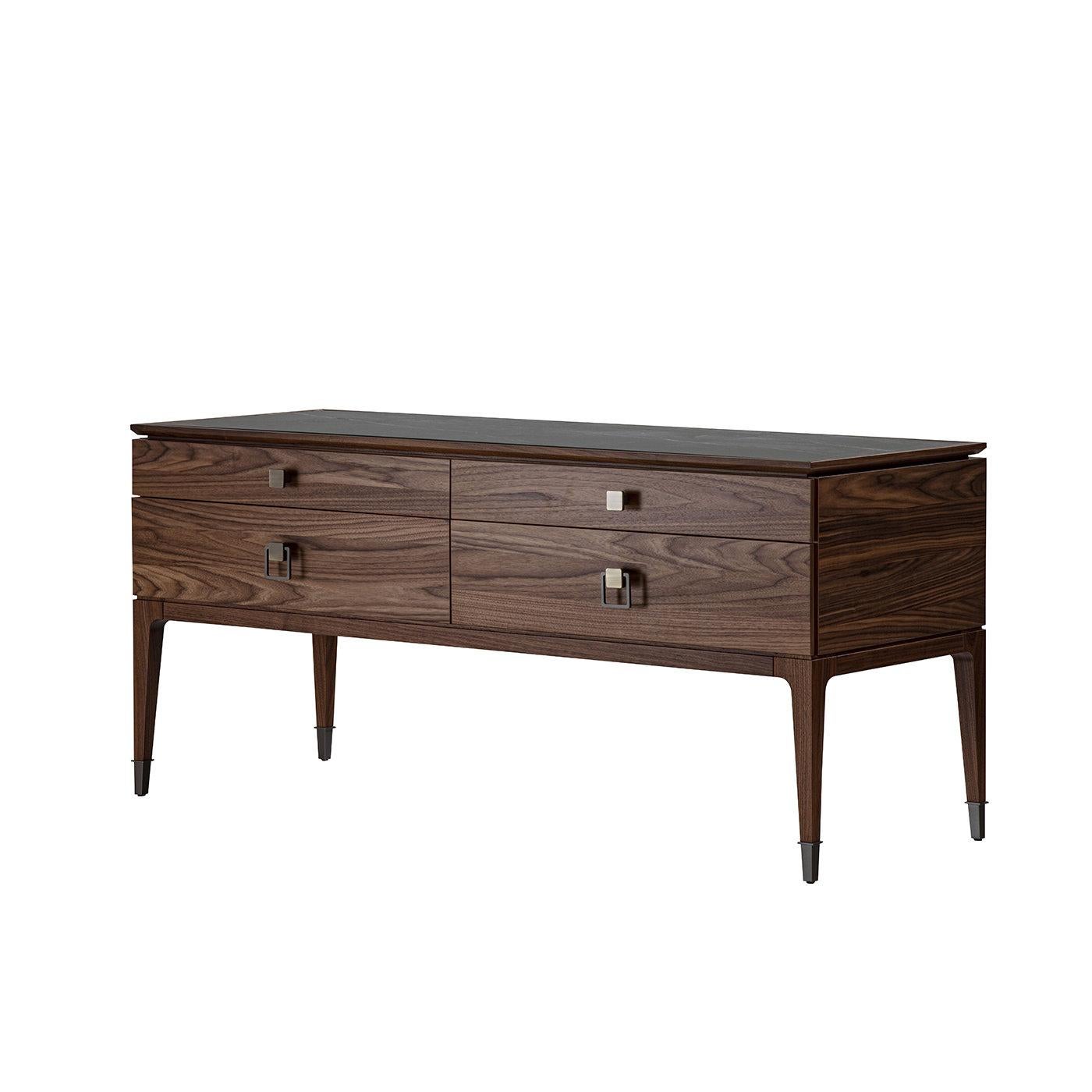 This elegant dresser fashioned of natural-finished walnut merges subtle influences borrowed from Art Deco and architecture typical of the Japanese city of Nara, creating a solid and sleek structure raised on tapered legs and featuring a tabletop in