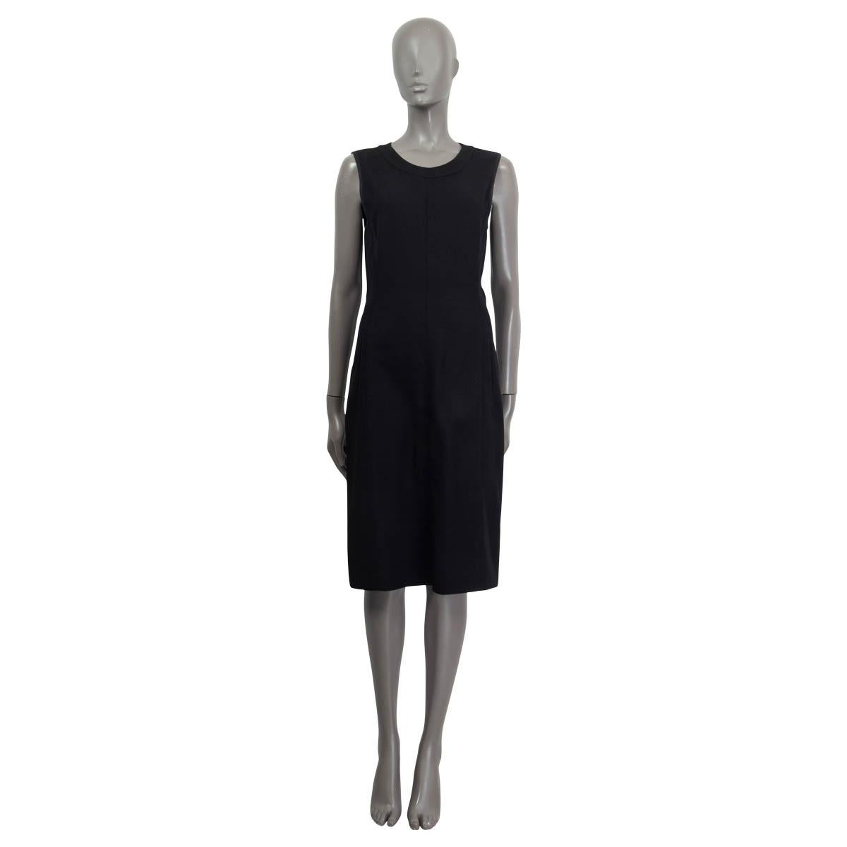 100% authentic Narcisco Rodriguez sleeveless sheath dress in black wool (100%) and silk (100%) lining. Opens with a zipper on the back and has two faux slit pockets on the side. Knee-length with a small slit in the side. Has been worn and is in