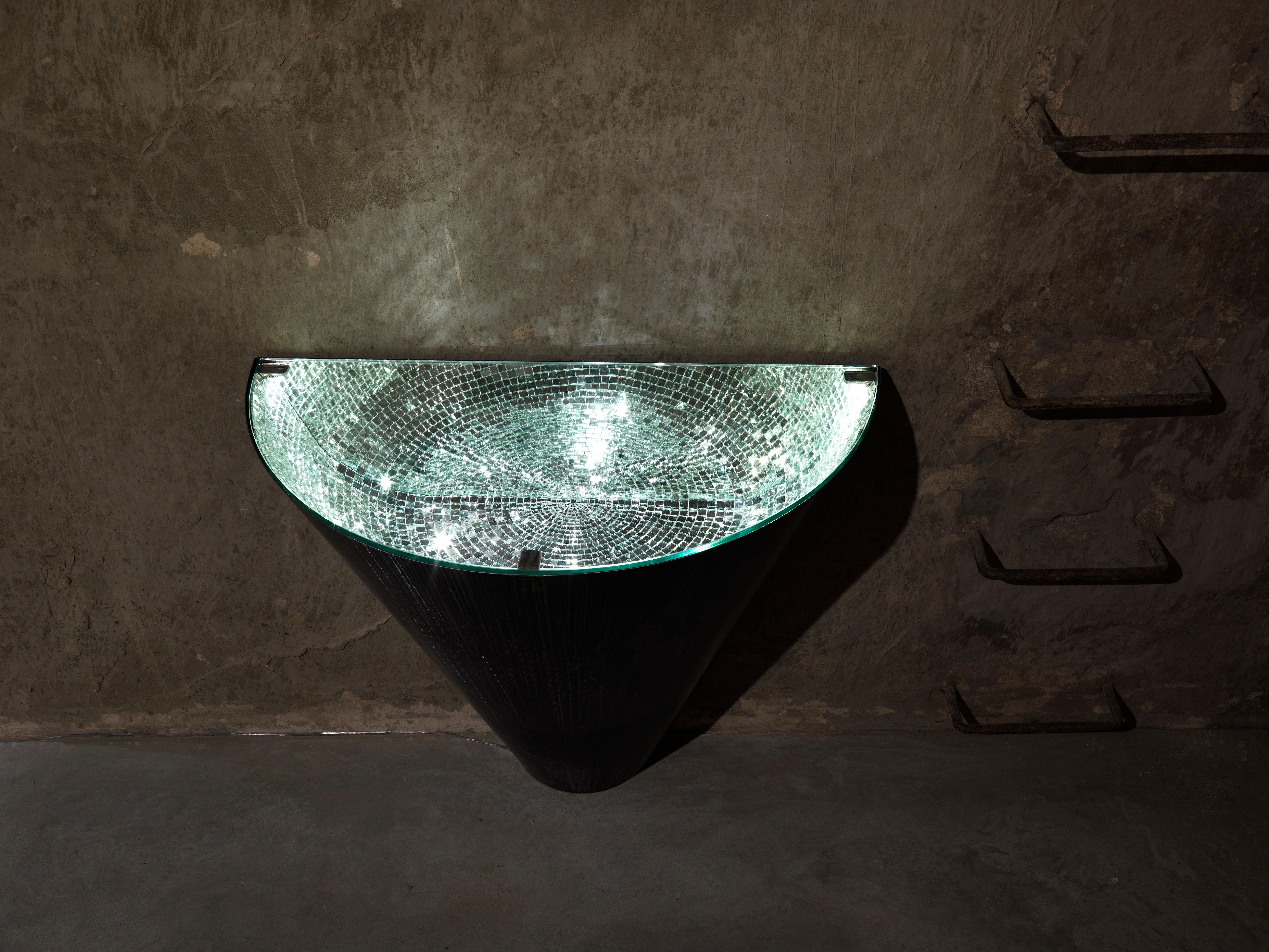 Narciso console by Davide Medri
Materials: mirror mosaic (silver), iron
Also available in gold. 
Dimensions: D 40 x W 60 x H 45 cm
Also available in 50 x 100 x 90 cm

Davide Medri was born in Cesena on August 7th 1967 and graduated at the Academy of