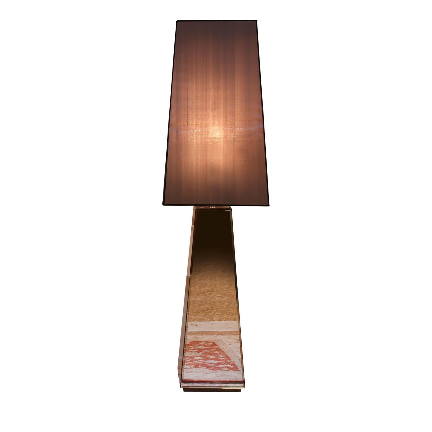 The Narciso L floor lamp is a deluxe accessory for your contemporary style home providing ambience and flair to any room. With the base in wood, the structure is covered in smoked bevelled mirror and is combined with a lampshade in cotton-linen