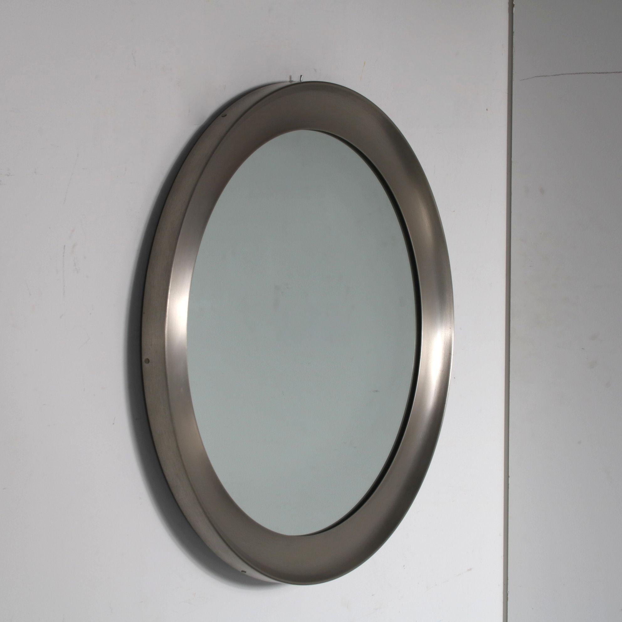 A beautiful and iconic mirror designed by Sergio Mazza, manufactured by Artemide in Italy around 1950.

“Narciso” is the model name of this eye-catching piece. It has a big round shape and aluminium edge, which gives the piece a very nice modern