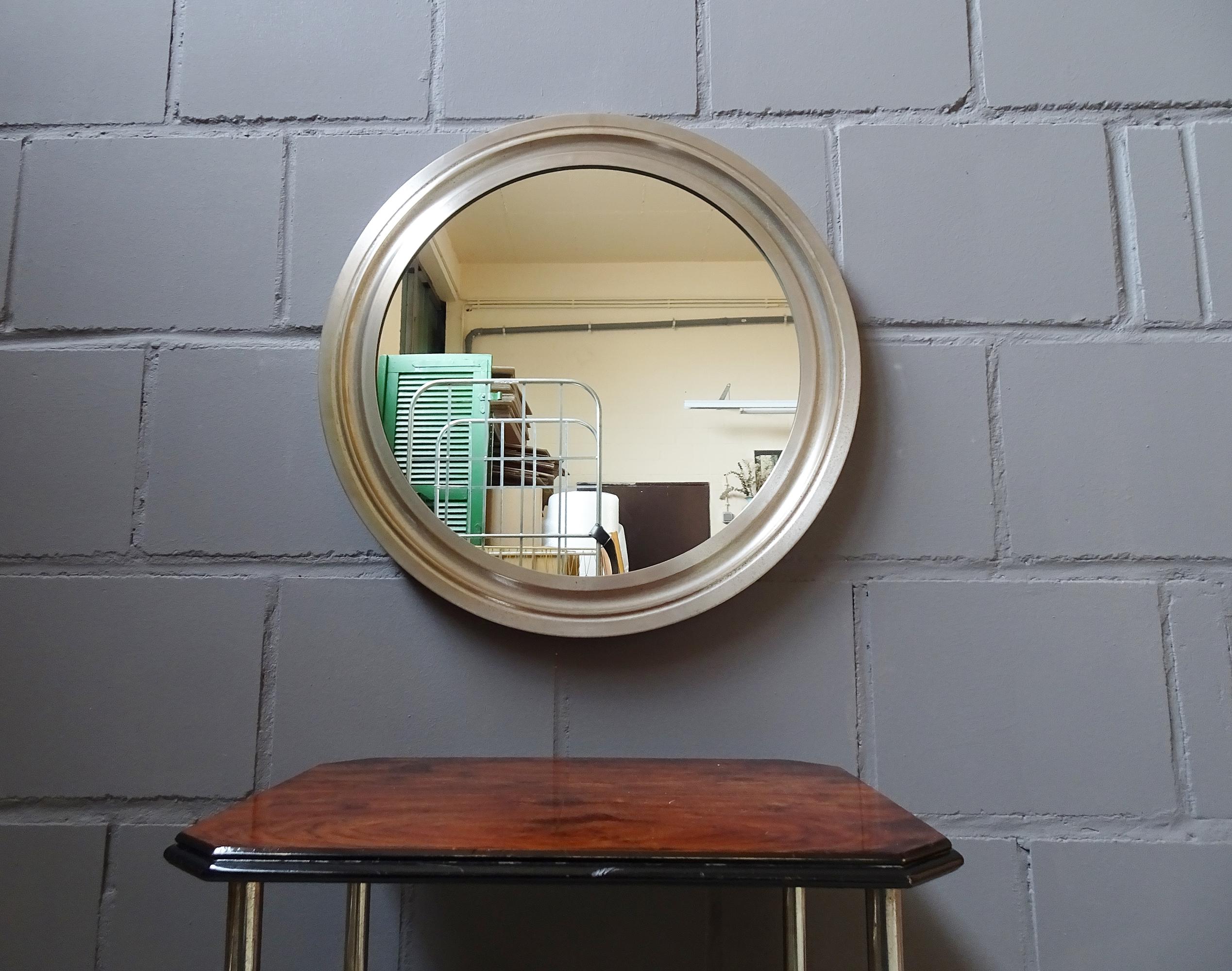 Modern Italian wall mirror, from the 1960s by Sergio Mazza for Artemide. The frame made of nickel-plated brass and its even patina gives it a timeless design. With a diameter of almost 60 cm, it is a great accent mirror.

Italian midcentury design.