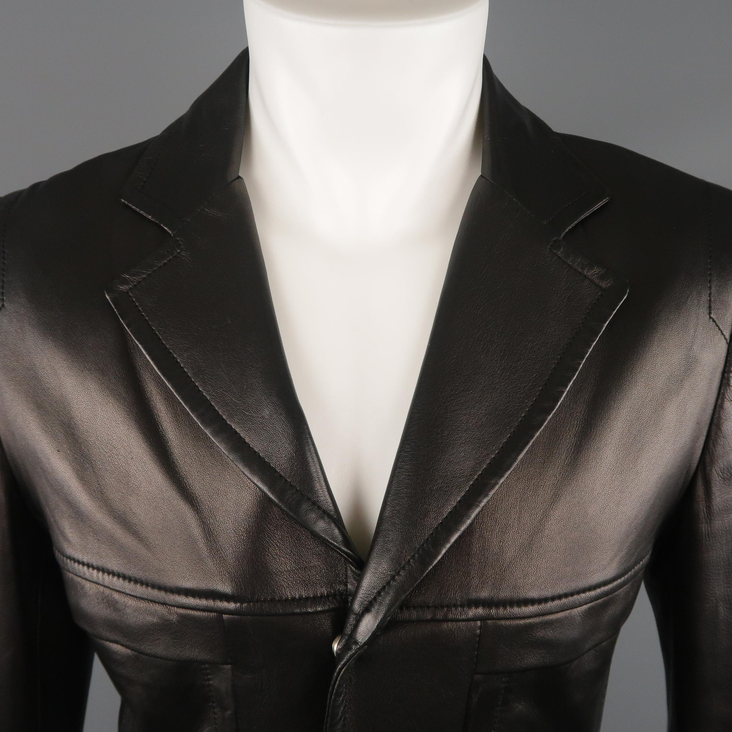 NARCISO RODRIGUEZ blazer comes in soft black sheepskin leather with a notch lapel, slit pockets, zip cuffs, and zip up front with snap placket. Wear throughout. Made in Italy.
 
Very Good Pre-Owned Condition.
Marked: IT 48
 
Measurements:
