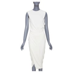 NARCISO RODRÍGUEZ: elegante vestido midi de mezcla de viscosa en color marfil con panel cruzado drapeado, talla IT38