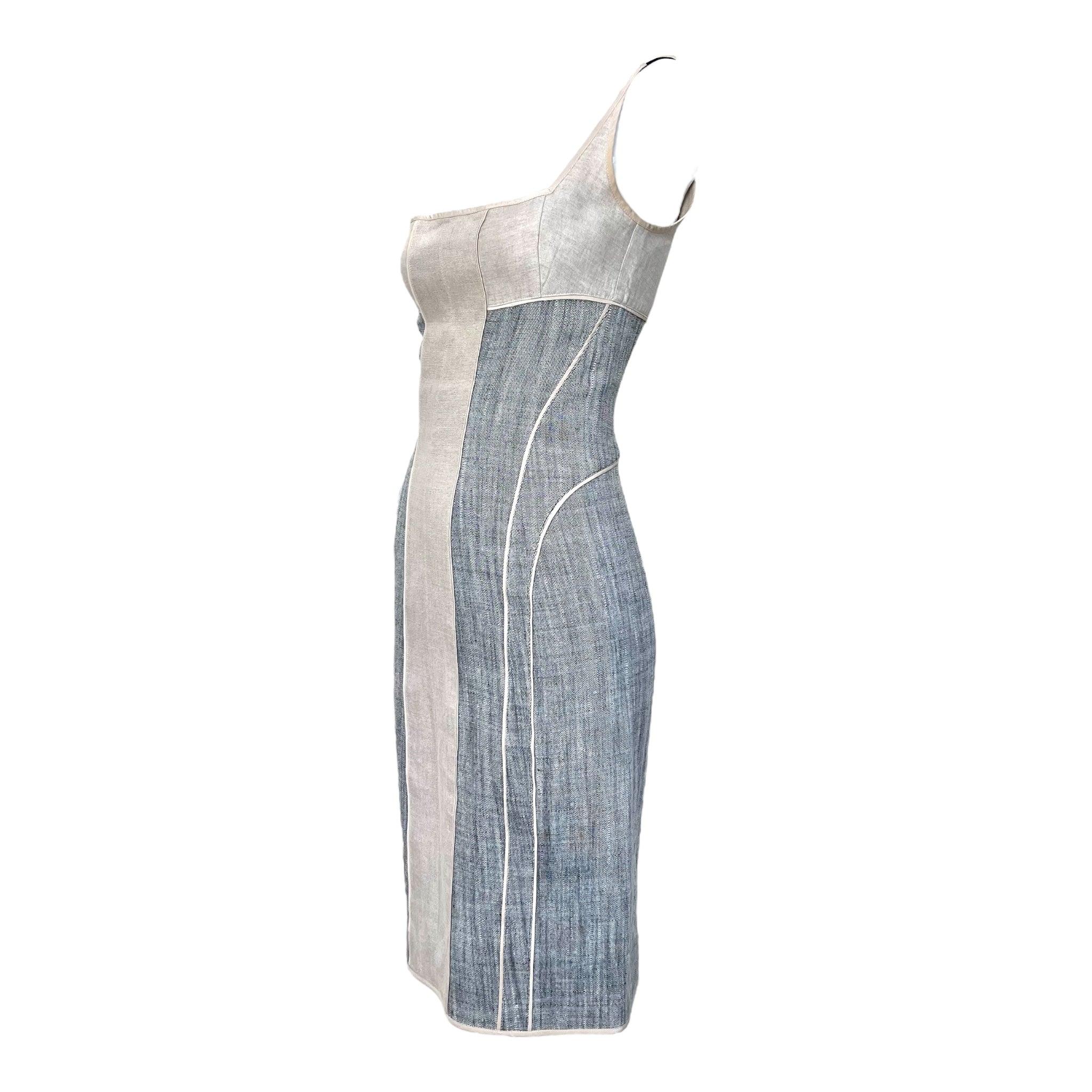 A minimal and modern dress by Narciso Rodriguez. Contrasting central panel running vertically down the length of the dress, thin straps, and a straight midi-length silhouette. Made out of 100% linen fabric. Great condition.

Additional