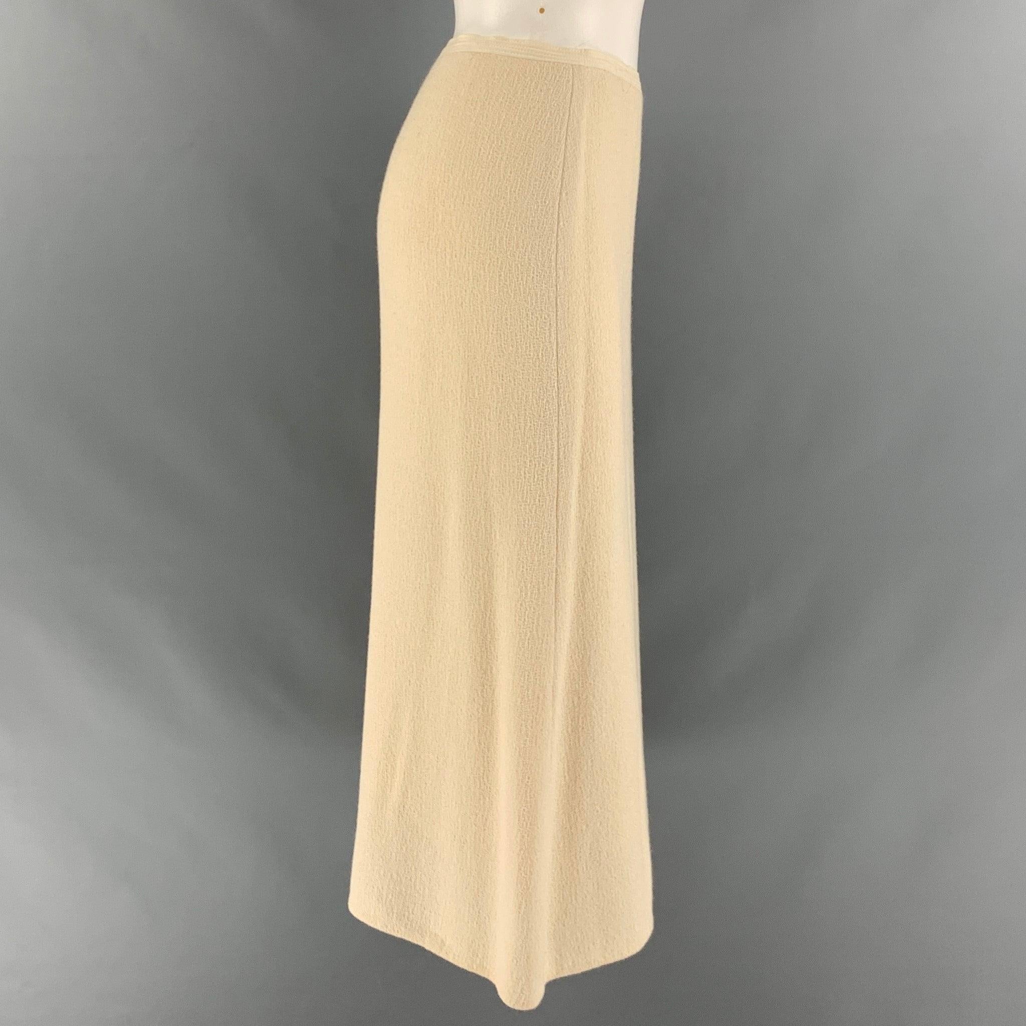 NARCISO RODRIGUEZ skirt comes in a cream viscose and wool woven material featuring a A-line silhouette, and a center side zip up closure. Made in Italy.Excellent Pre-Owned Condition. 

Marked:   41 

Measurements: 
  Waist: 31 inches Hip: 37 inches