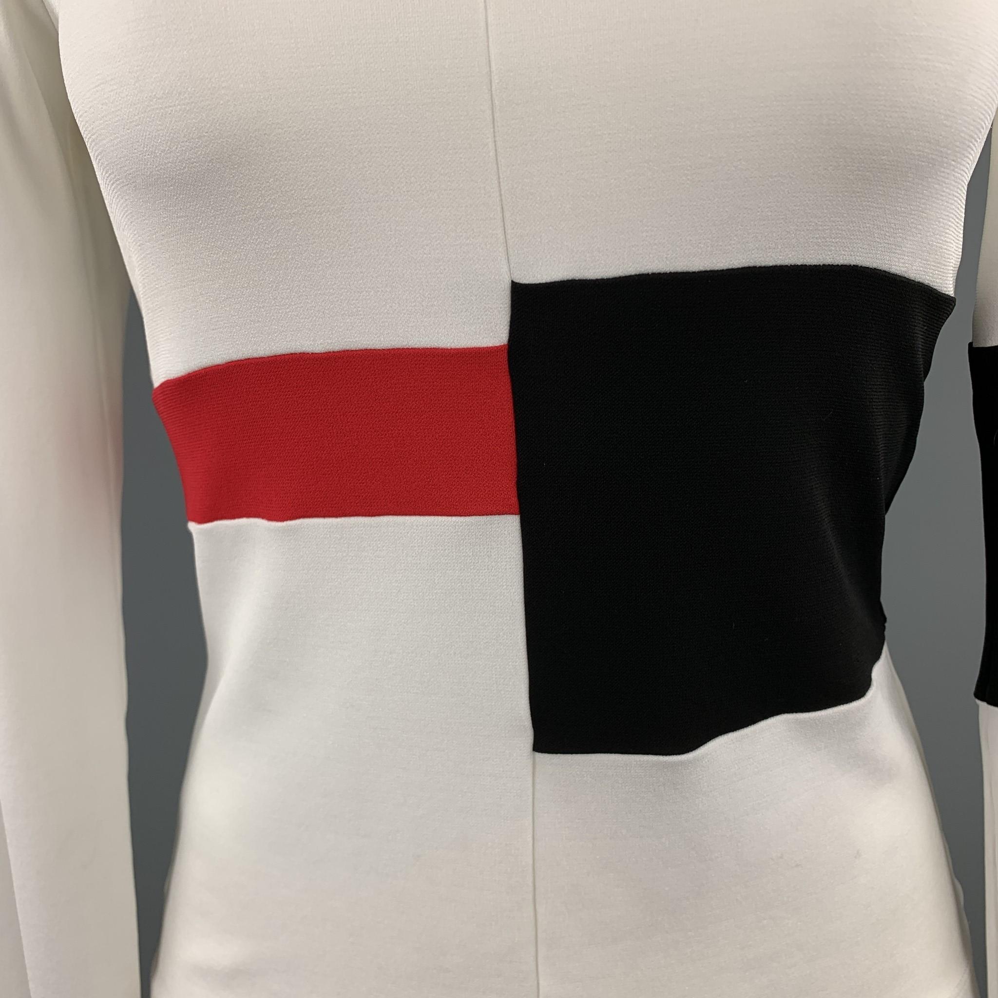 NARCISCO RODRIGUEZ pullover blouse comes in cream crepe stretch chiffon with red and black geometric color block panels.  Wear throughout. Made in Italy.

Very Good Pre-Owned Condition.
Marked: USA 6

Measurements:

Shoulder: 15 in.
Bust: 34