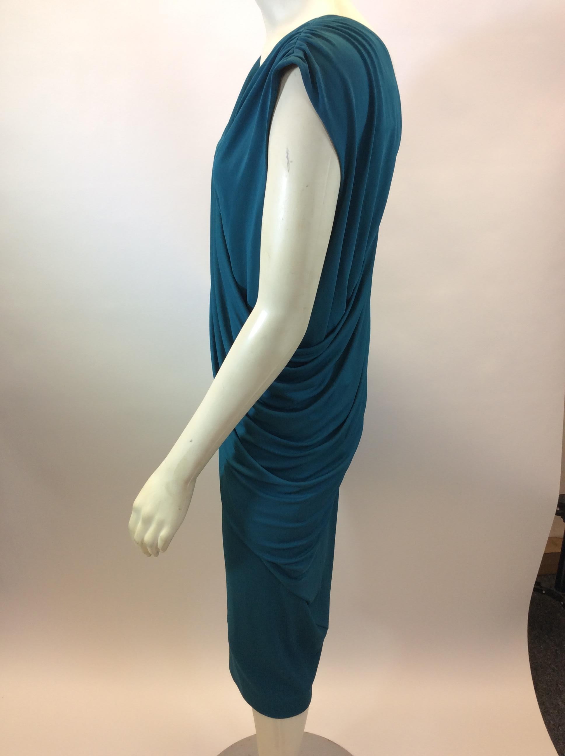 Narciso Rodriguez Teal Dress
$150
Made in Italy
Size 46
Length 40