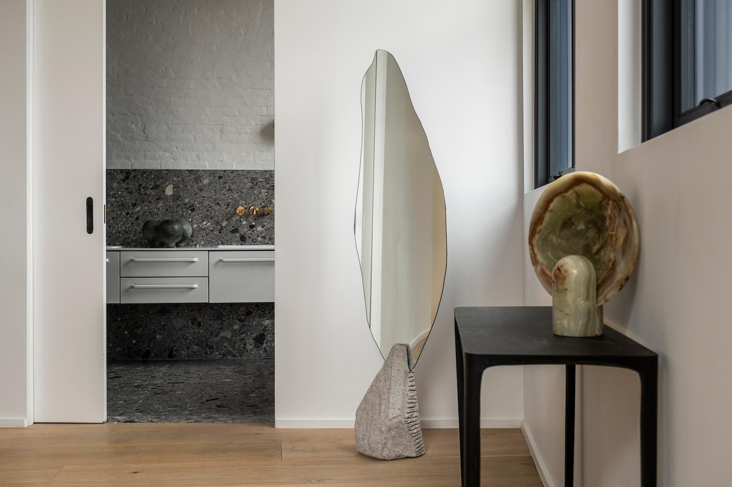 Narciso Uno Mirror by Andres Monnier Treko Concrete
Dimensions: W 60 x D 30 x H 180 cm.
Materials: Grey quarry stone, mirror. 

Narciso mirror is a piece inspired by the myth of Narciso, of greek mythology. The shape of the mirror represents the