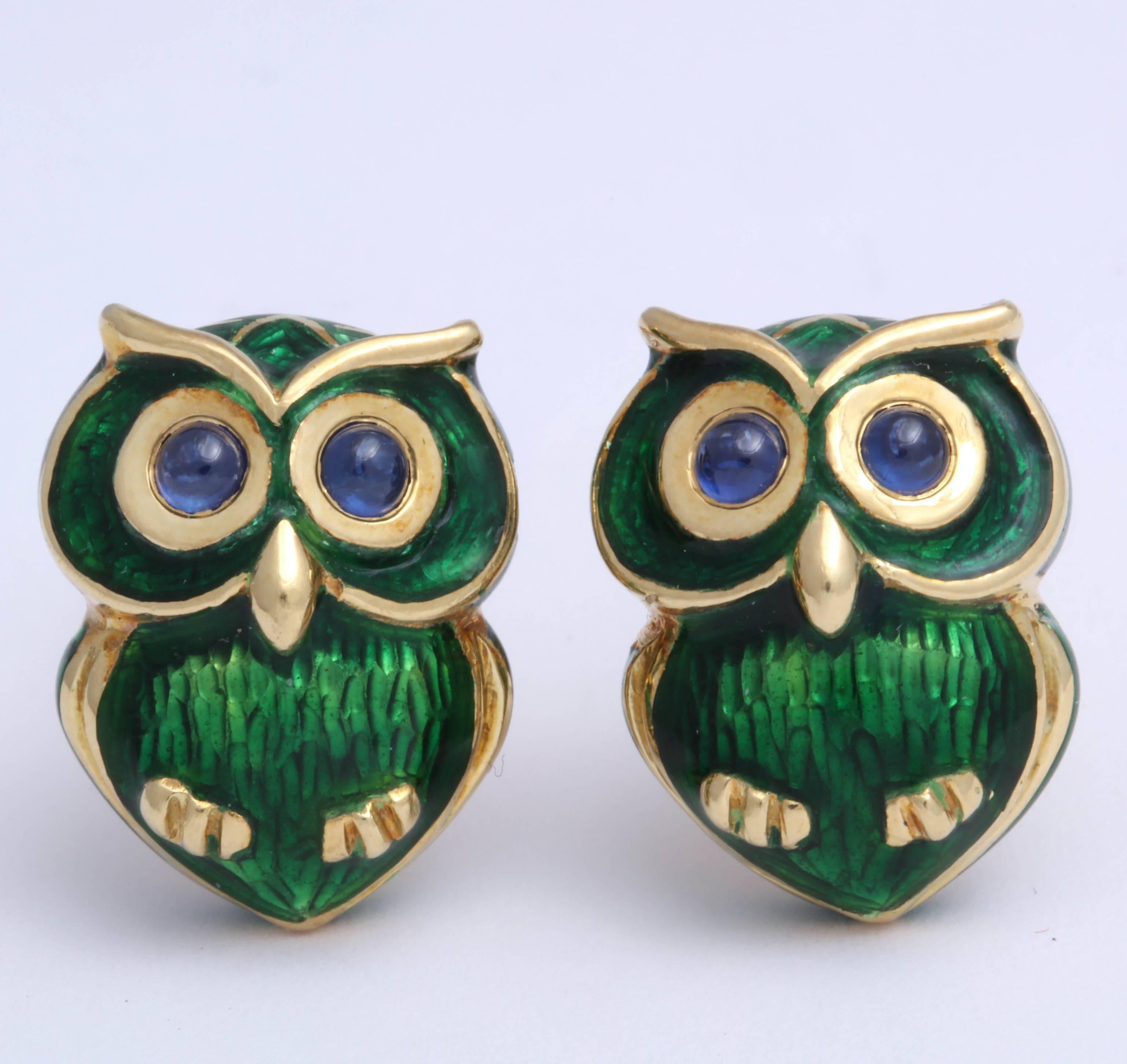 Pair of stylized Owls in 18kt Yellow Gold and Green Enamel with Cabochon Sapphire Eyes - playfully perched  and ready to Fly.
Signed  and marked 750 with an Italian control mark.  Easy to wear Tbar backs.