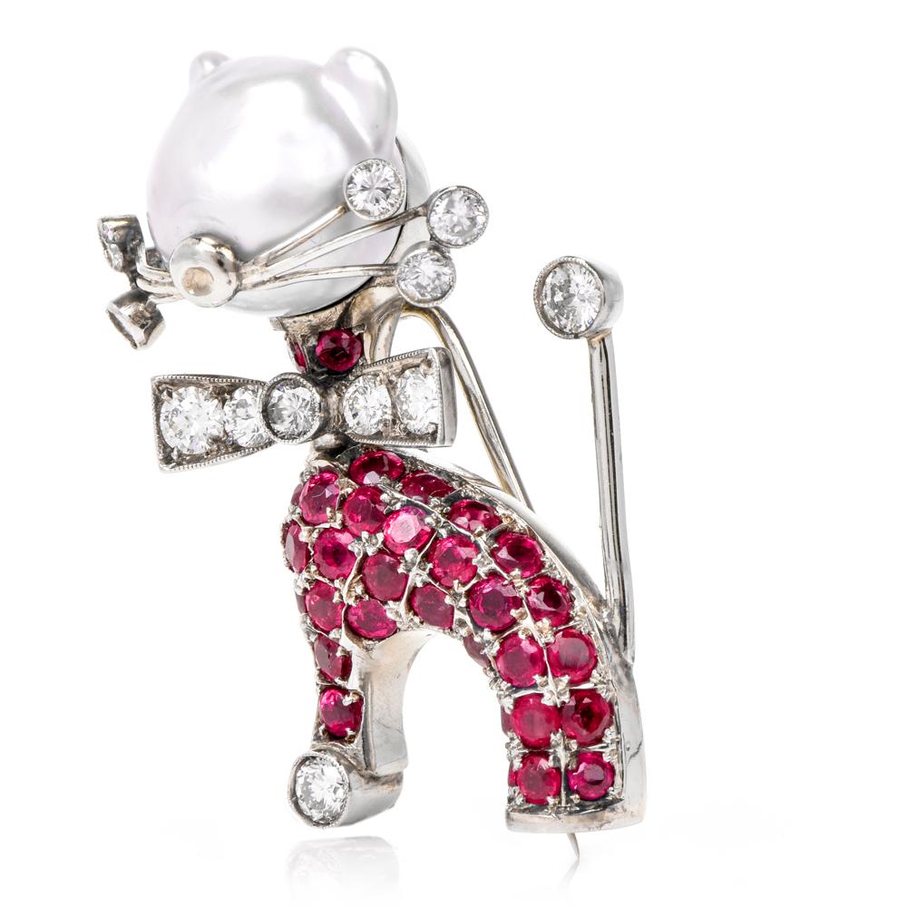 This avant garde vintage Nardi brooch of interesting and unusual design simulates a surrealistic silhouette of a cat, with the body swathed in rubies, the head depicted with a 9 mm pearl. The enchanting brooch is crafted in solid 18K white gold ,