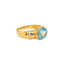 Nari Fine Jewels Half Bezel Oval Blue Topaz and Diamond Ring 14K Yellow Gold
