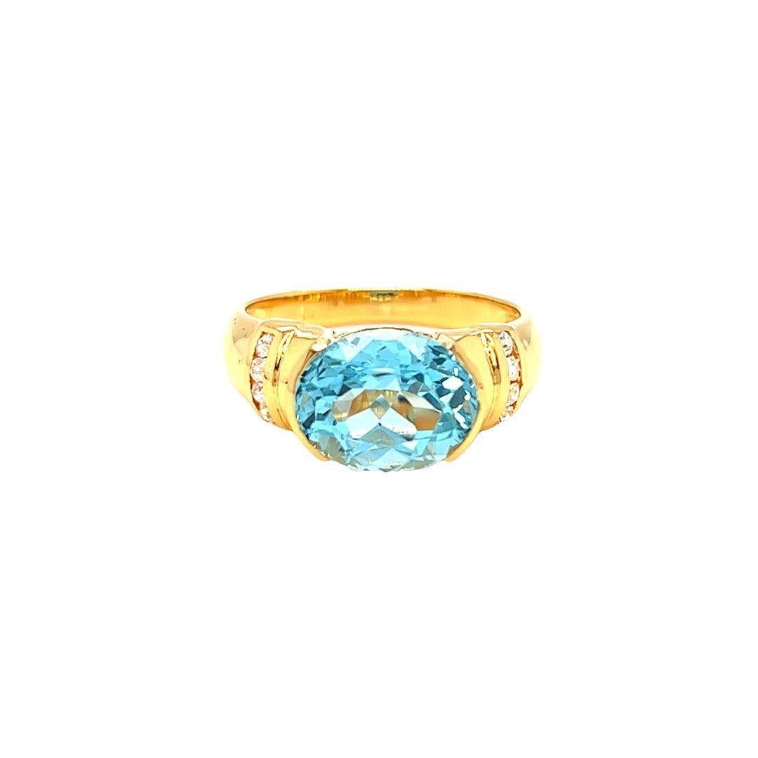 Nari Fine Jewels Half Bezel Oval Blue Topaz and Diamond Ring 14K Yellow Gold In New Condition For Sale In beverly hills, CA