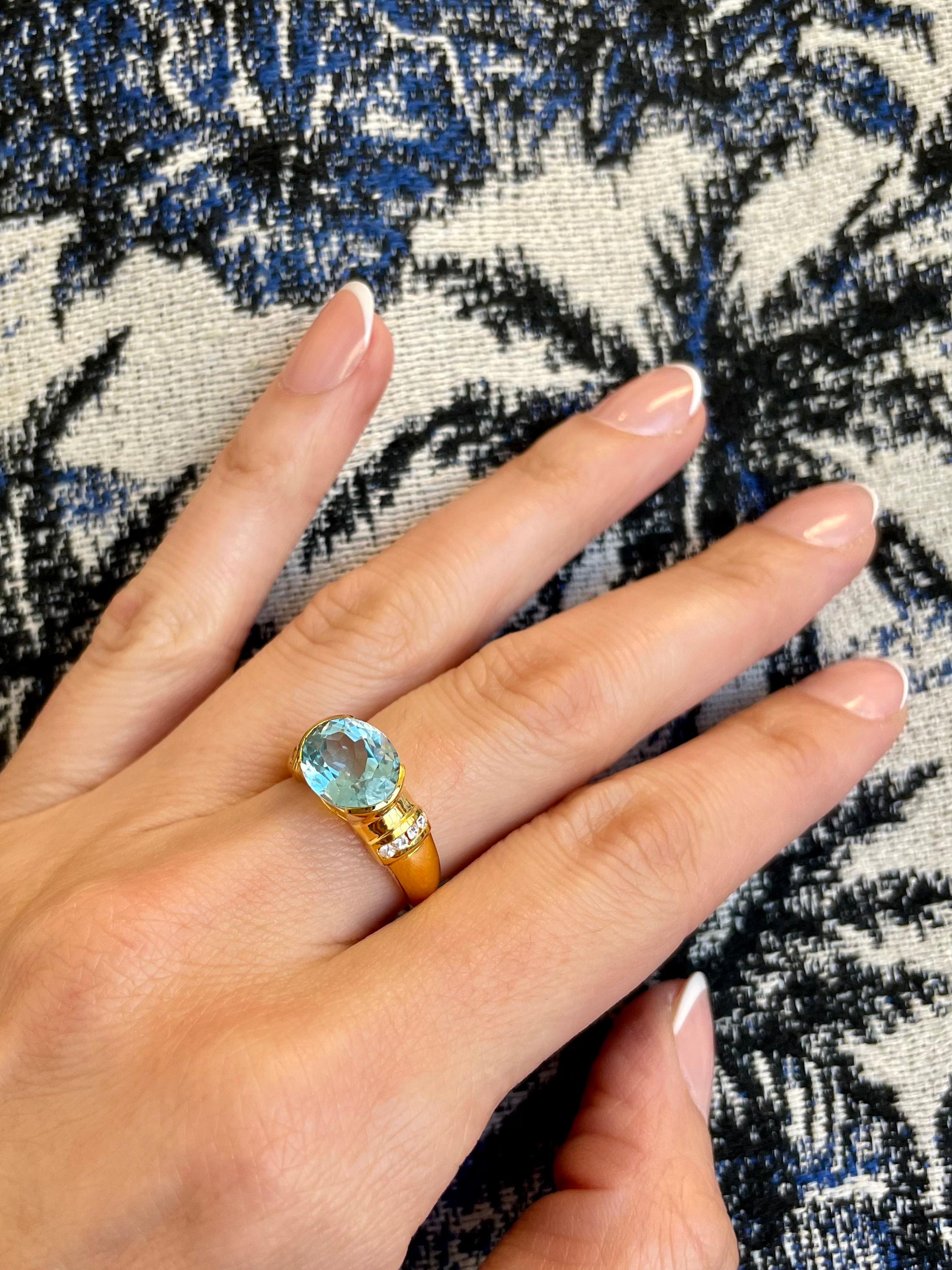 Women's Nari Fine Jewels Half Bezel Oval Blue Topaz and Diamond Ring 14K Yellow Gold For Sale