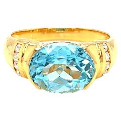 Nari Fine Jewels Half Bezel Oval Blue Topaz and Diamond Ring 14K Yellow Gold