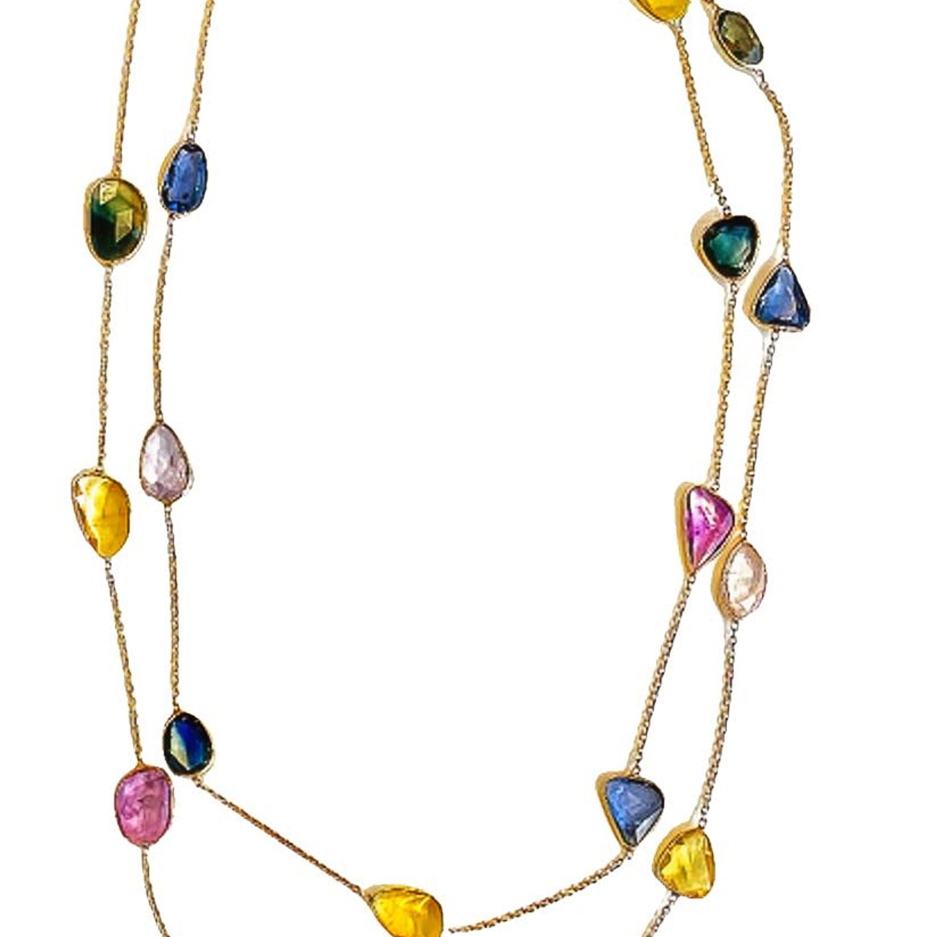Fancy Sapphire comes in arrays of colors. And here is a gorgeous way to show them all in our signature station necklace. Each gem is set by hand in fine bezel to accentuate the natural color of these gems. This 18 karat yellow gold station necklace