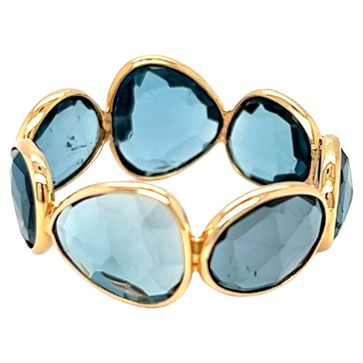Nari Fine Jewels London Bague d'éternité en or jaune 18 carats avec topaze bleue, fabriquée à la main