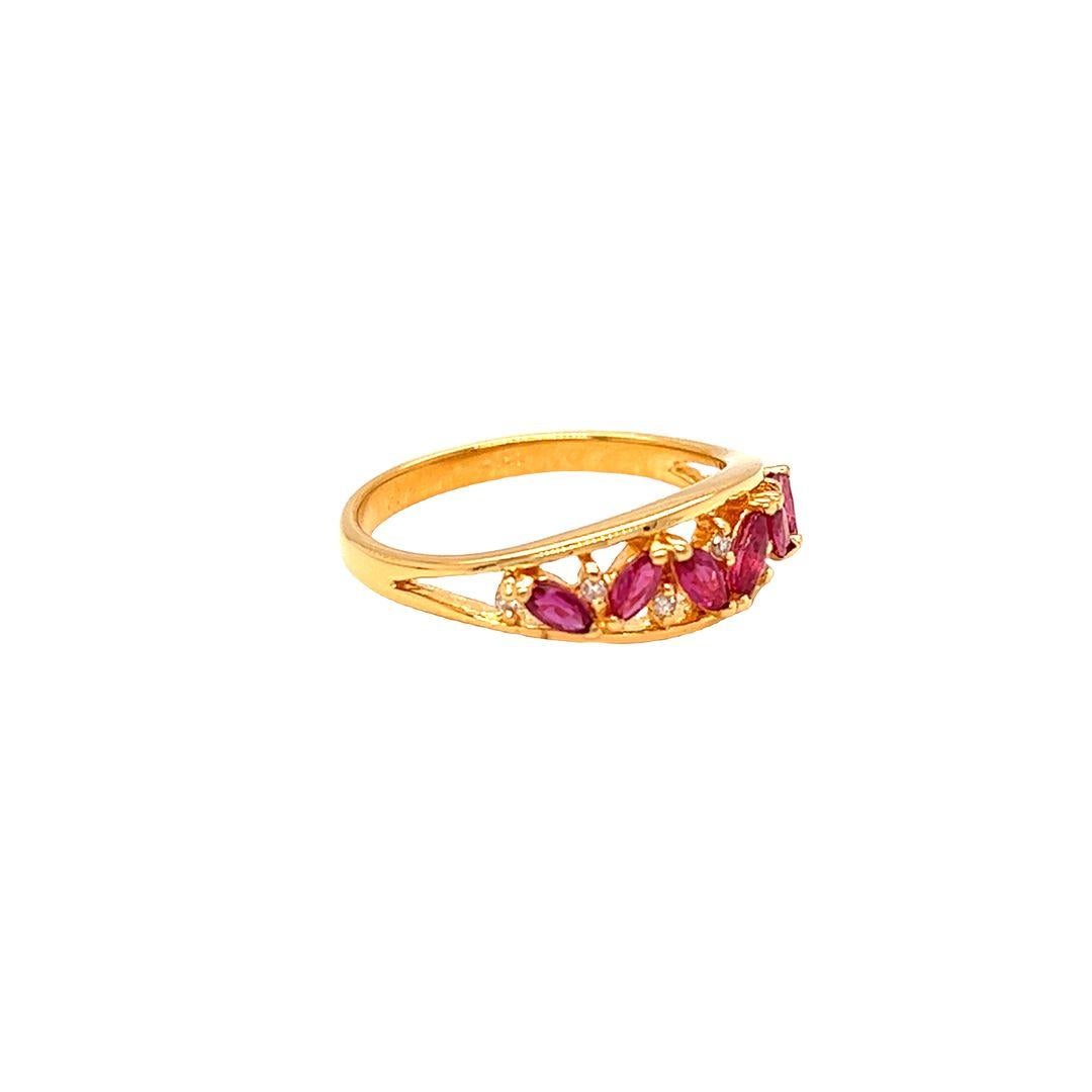 Created by Nari Fine Jewels, Marquise Ruby & Diamond Ring features 0.40 carat of marquise cut rubies highlighted with 7 round diamonds. Intricately crafted with a face of 6.3 mm and a height of 3.87 mm, this ring is a timeless piece for a special