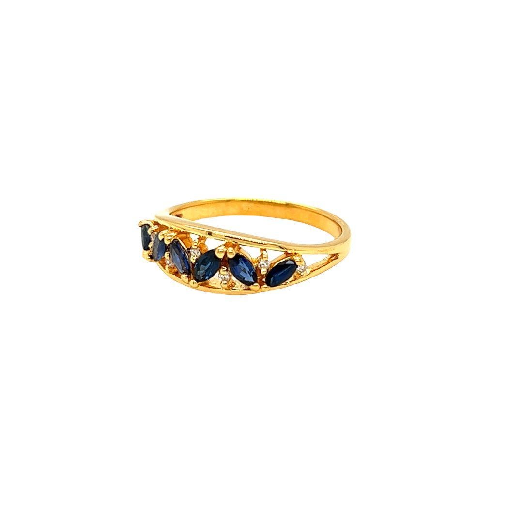 Created by Nari Fine Jewels, Marquise Sapphire & Diamond Ring features 0.40 carat of marquise cut sapphire highlighted with 7 round diamonds. Intricately crafted with a face of 6.3 mm and a height of 3.87 mm, this ring is a timeless piece for a