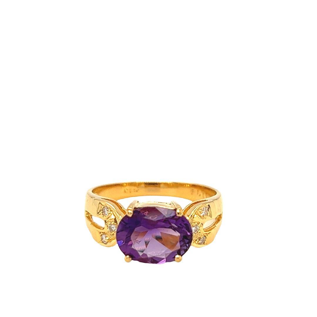14K Yellow Gold Fashion Ring featuring a captivating east-west prong-set oval-cut Amethyst. The ring showcases a stunning large oval Amethyst semi-precious gemstone, measuring approximately 10 mm x 8 mm and weighing approximately 3 carats.

A