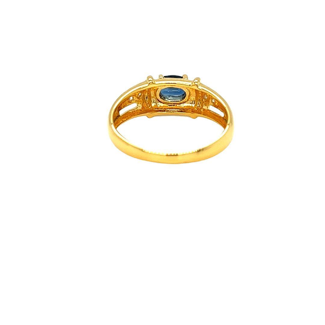 Contemporary Nari Fine Jewels Oval Blue Sapphire and Diamond Ring 14K Yellow Gold For Sale