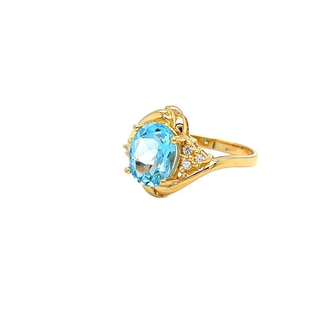 Bypass-Ring aus 14 Karat Gelbgold mit ovalem blauem Topas und Diamanten von Nari Fine Jewels (Ovalschliff) im Angebot