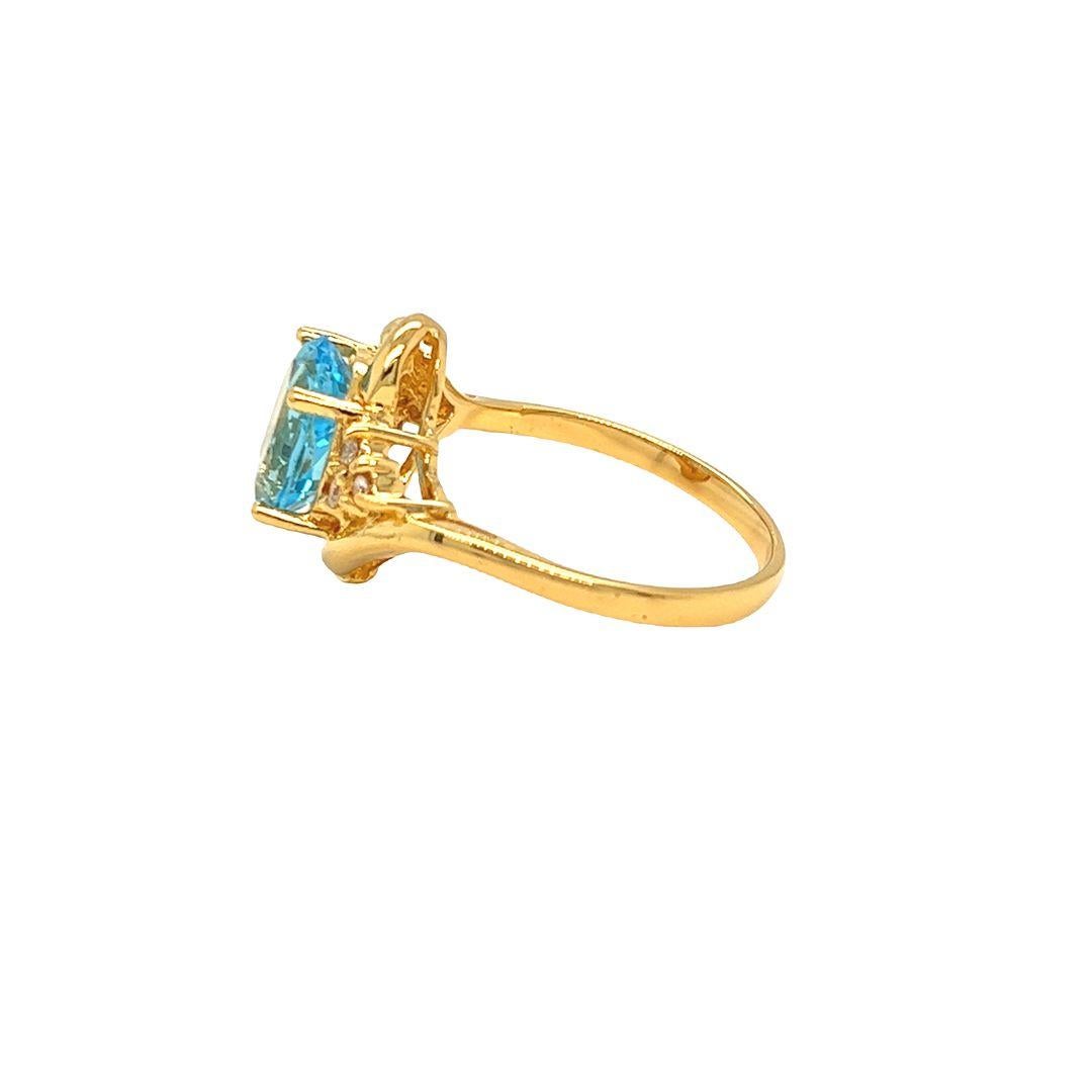 Bypass-Ring aus 14 Karat Gelbgold mit ovalem blauem Topas und Diamanten von Nari Fine Jewels Damen im Angebot
