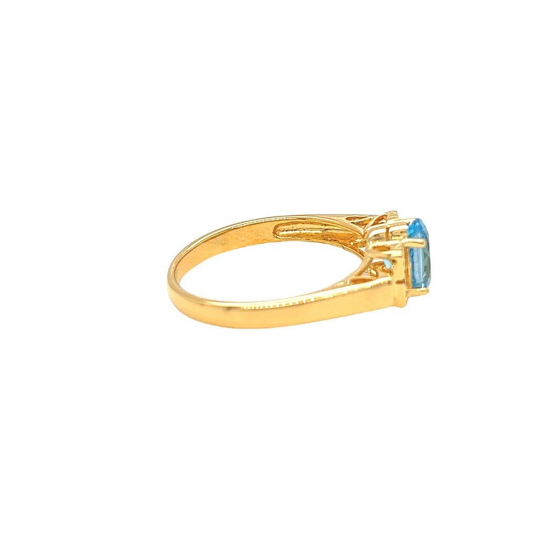 Contemporary Nari Fine Jewels Oval Blue Topaz and Diamond Ring 14K Yellow Gold For Sale