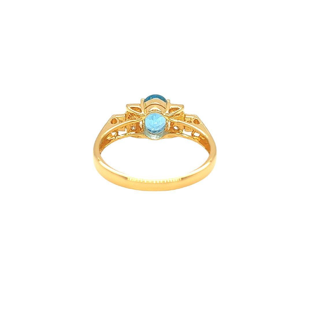 Oval Cut Nari Fine Jewels Oval Blue Topaz and Diamond Ring 14K Yellow Gold For Sale