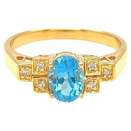 Nari Fine Jewels Oval Blue Topaz and Diamond Ring 14K Yellow Gold For Sale