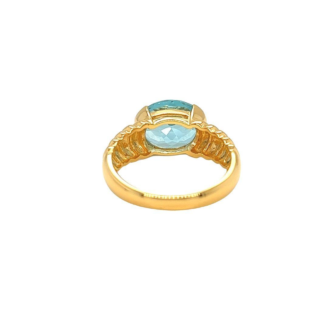 Oval Cut Nari Fine Jewels Oval Blue Topaz Fluted Dome Ring 14K Yellow Gold For Sale