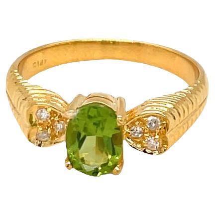 Nari Fine Jewels Oval Peridot and Diamond Ring Heart Accent 14K Yellow Gold For Sale