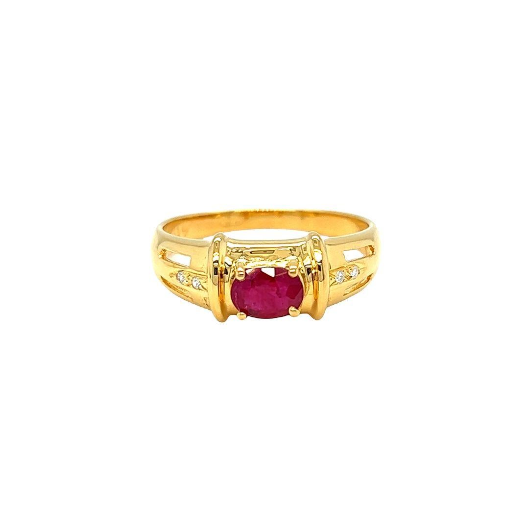 Enjoy the beauty and sparkle created by Nari Fine Jewels, 0.40 carat oval ruby and diamond ring crafted in 14K yellow gold. On each side of the shank are two round-cut diamonds totaling 0.04 carat and measuring 7.5 mm in face and 5.3 mm in height.