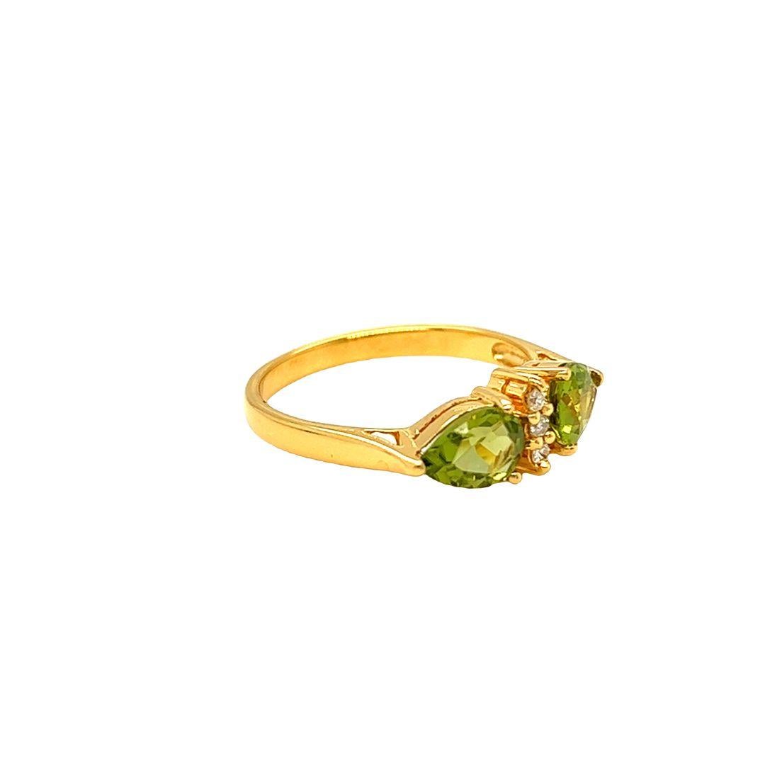 Contemporary Nari Fine Jewels Twin Pear Shaped Peridot and Diamond Ring 14K Yellow Gold For Sale