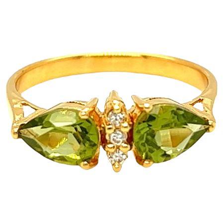 Nari Fine Jewels Twin Pear Shaped Peridot and Diamond Ring 14K Yellow Gold For Sale