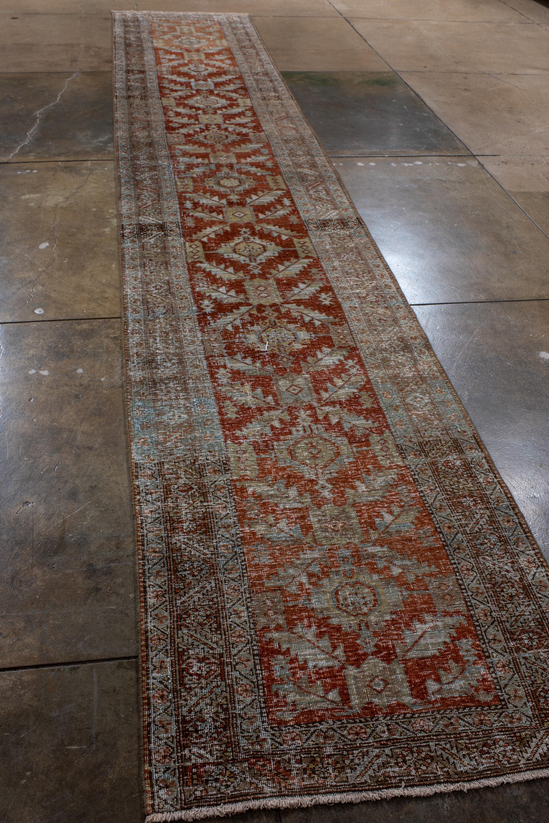 Persian Narrow Antique Heriz Runner with Red Field  For Sale