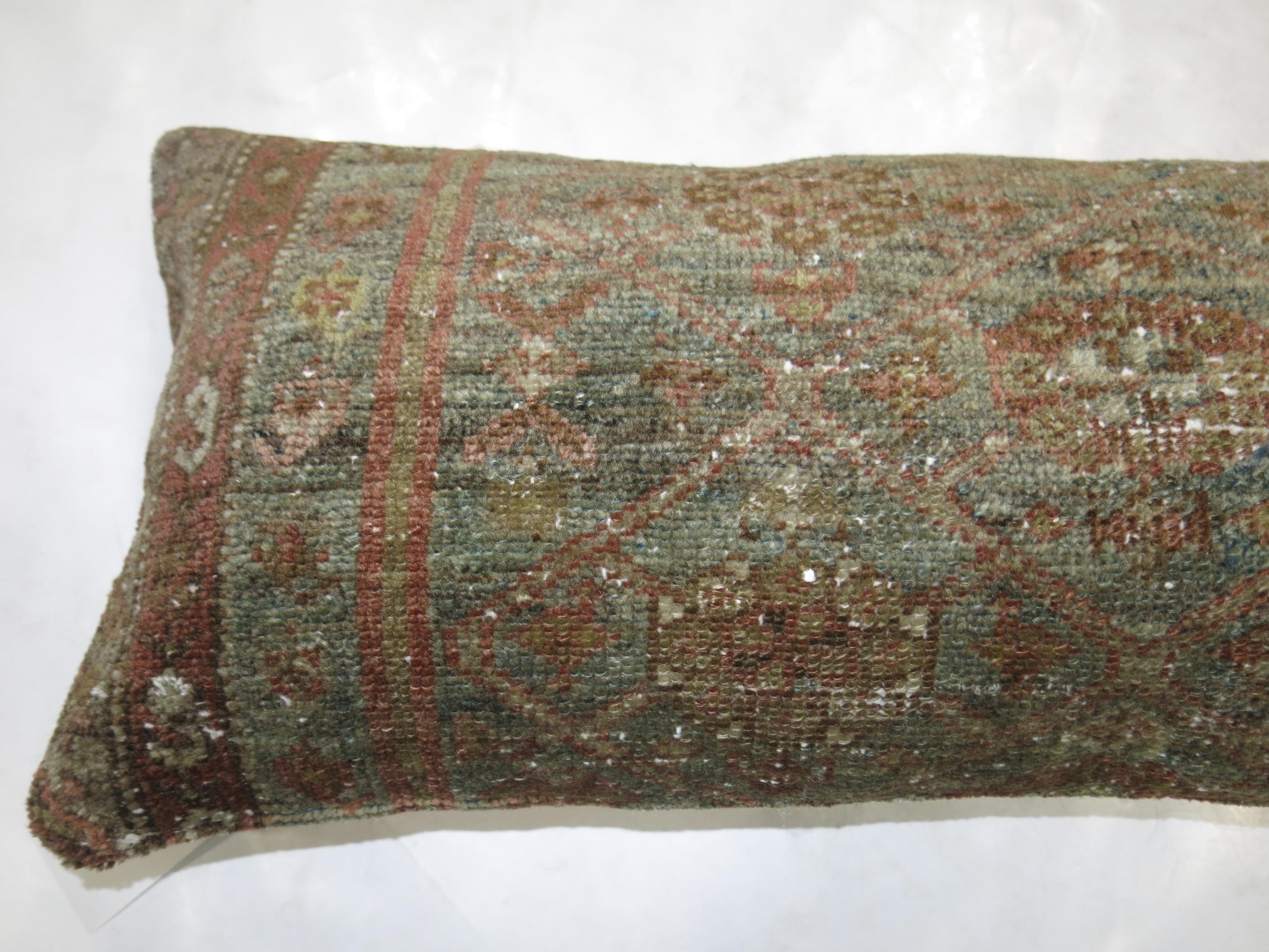 Rare bolster size pillow made from an early 20th century Persian Malayer rug.

Measures: 12'' x 37''.