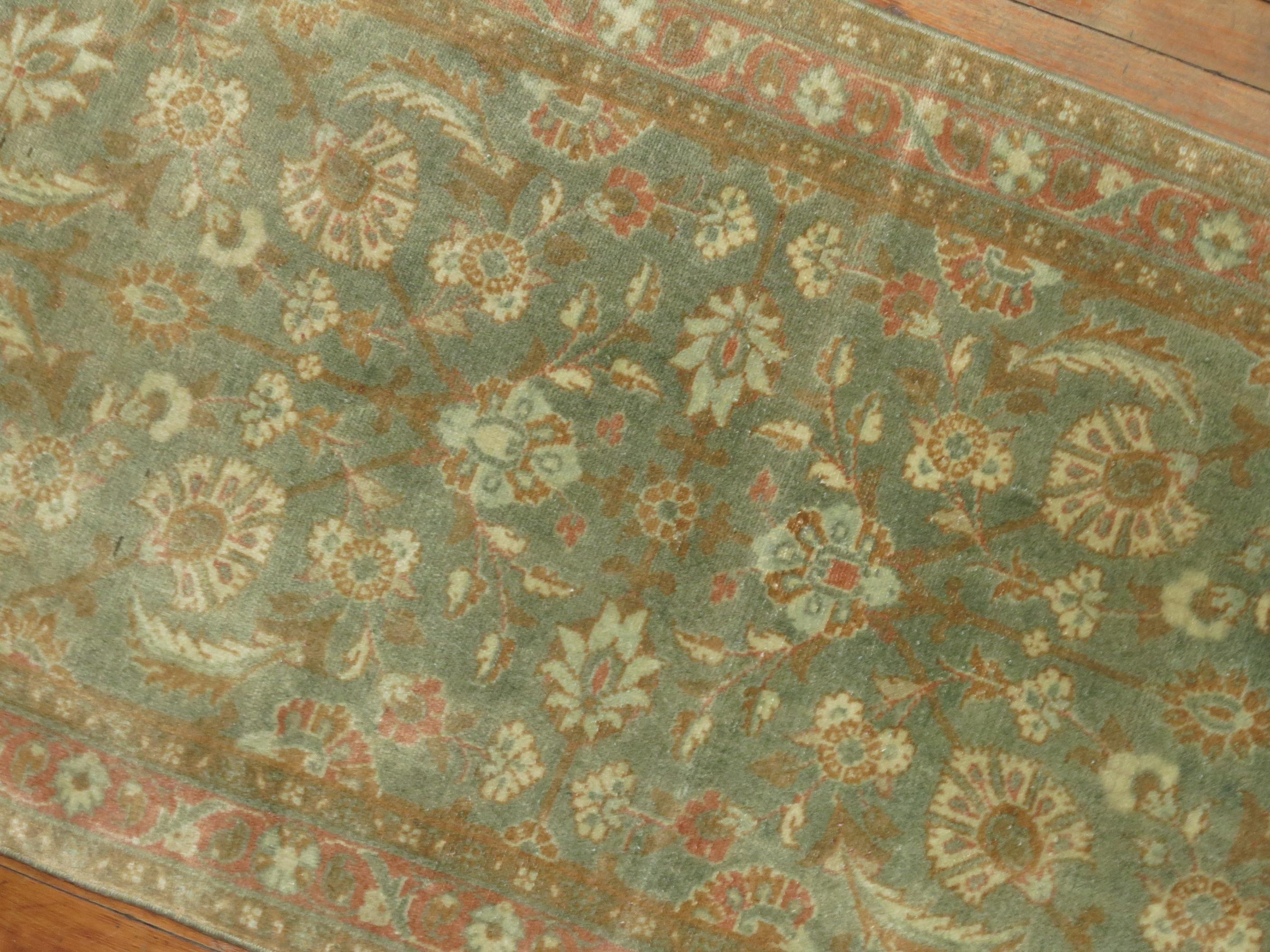 Decorative Persian antique Tabriz one-of-a-kind antique narrow runner from the 1940s in brown and green.

Measures: 2'4” x 14'.