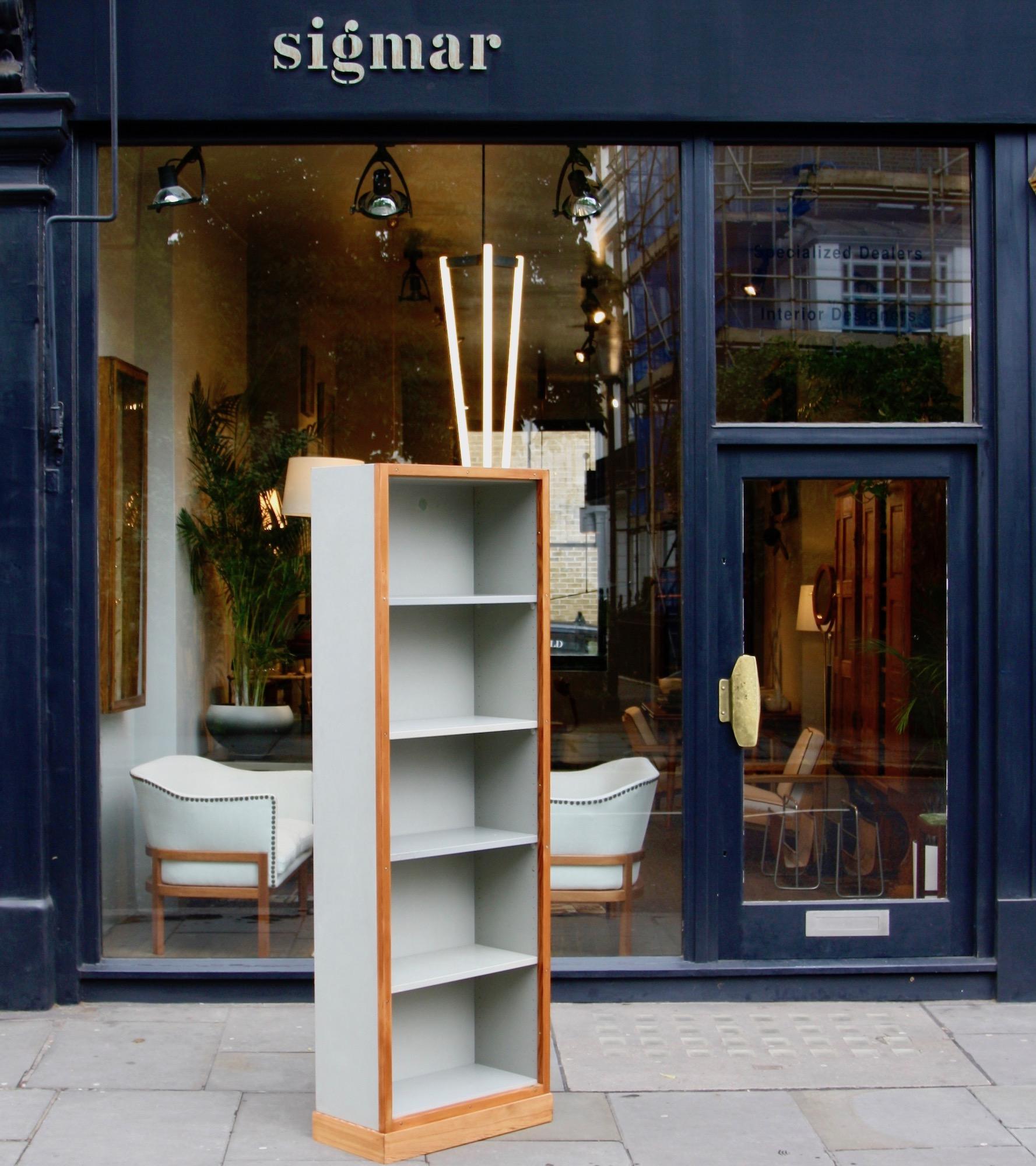 A narrow bookcase know as 'Boligens Byggeskabe' (literal translation Housing Cabinets) designed by Børge Mogensen and Grete Meyer, 1952-1956, and produced by C. M. Madsens factories, Sweden. Both the bookcase's interior and exterior are painted grey