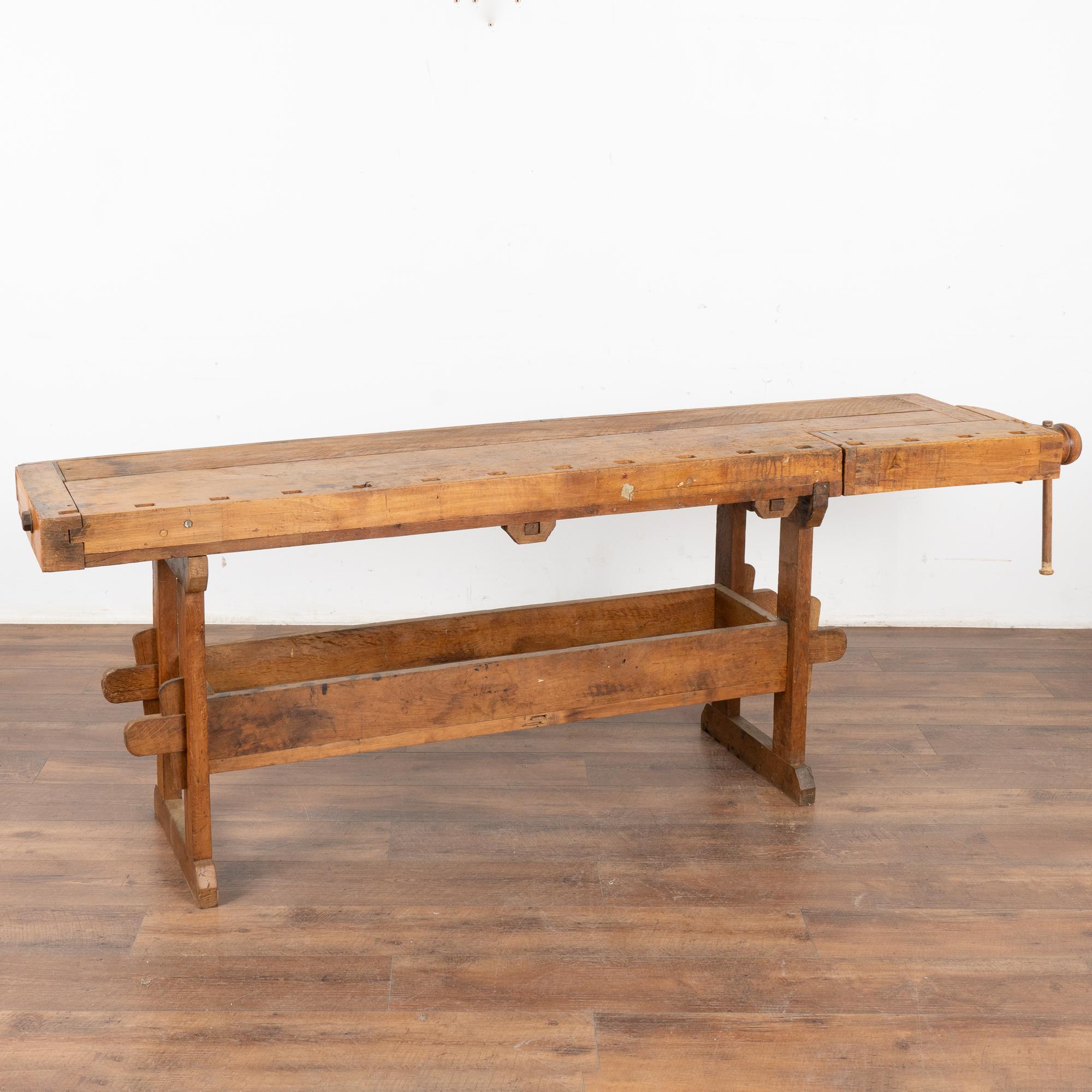 It is the years of constant use revealed in every ding and scratch that enrich the character of this carpenters' workbench from Denmark.
Please examine the close up photos to appreciate the deep patina, joints and old hardware.
It has one vice with