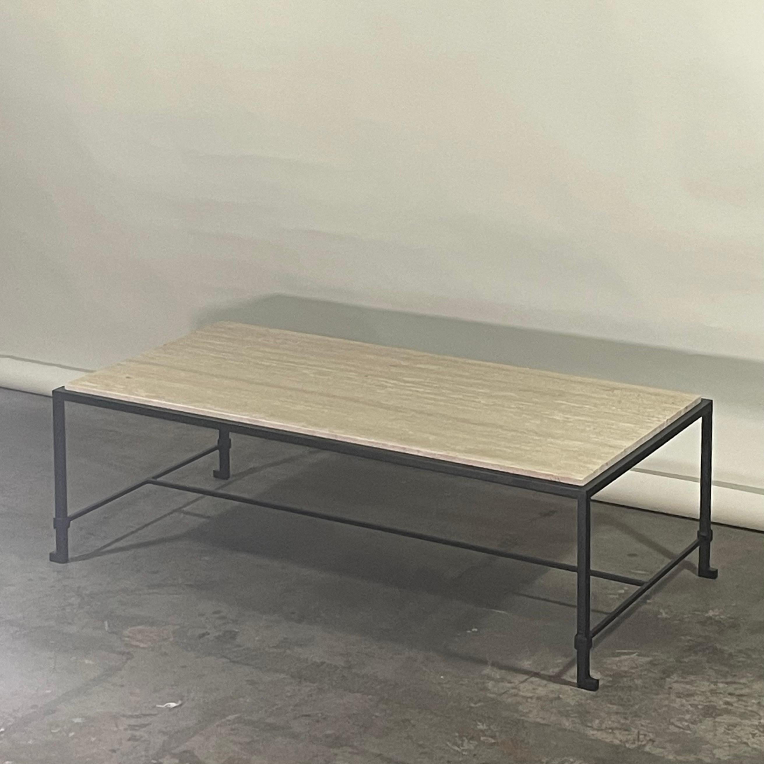 Narrow 'Diagramme' blackened steel and travertine coffee table by Design Frères.

Blackened steel base fitted with an Italian cream travertine top. Inspired by the timeless aesthetic of French modern design, this console from our exclusive Design