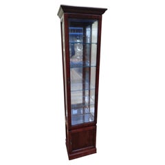 Narrow display cabinet in cherry wood