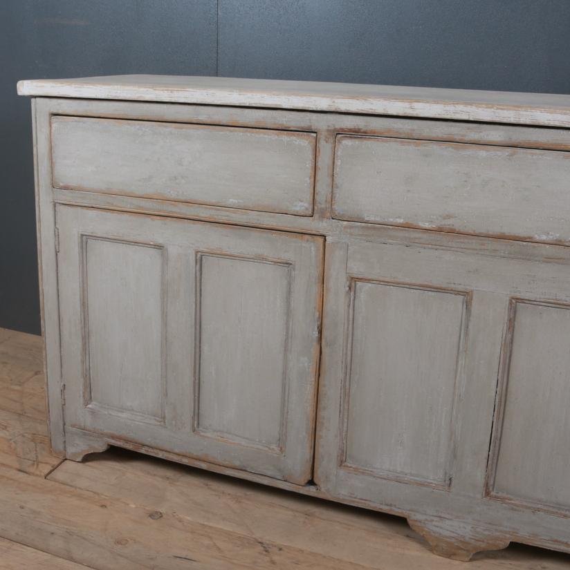 19th century English painted narrow dresser base. Awaiting hardware, 1840.

Dimensions:
75 inches (191 cms) wide
17 inches (43 cms) deep
33.5 inches (85 cms) high.

 