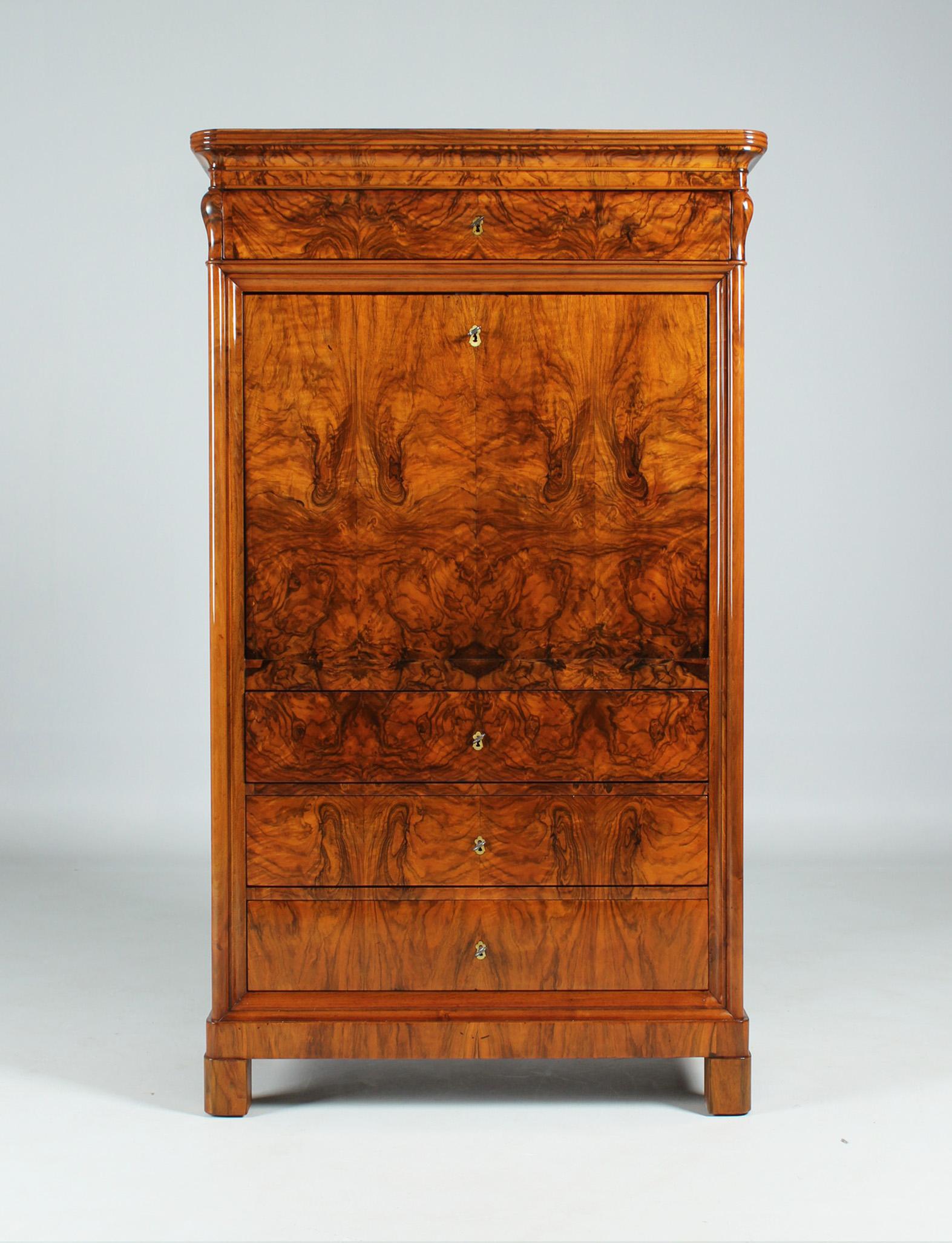 Narrow antique Biedermeier cabinet with secret compartment

Hesse/Palatinate
Walnut etc.
Biedermeier around 1840

Dimensions: H x W x D: 161 x 95 x 49 cm

Description:
Narrow, slender and well-proportioned secretary from the late