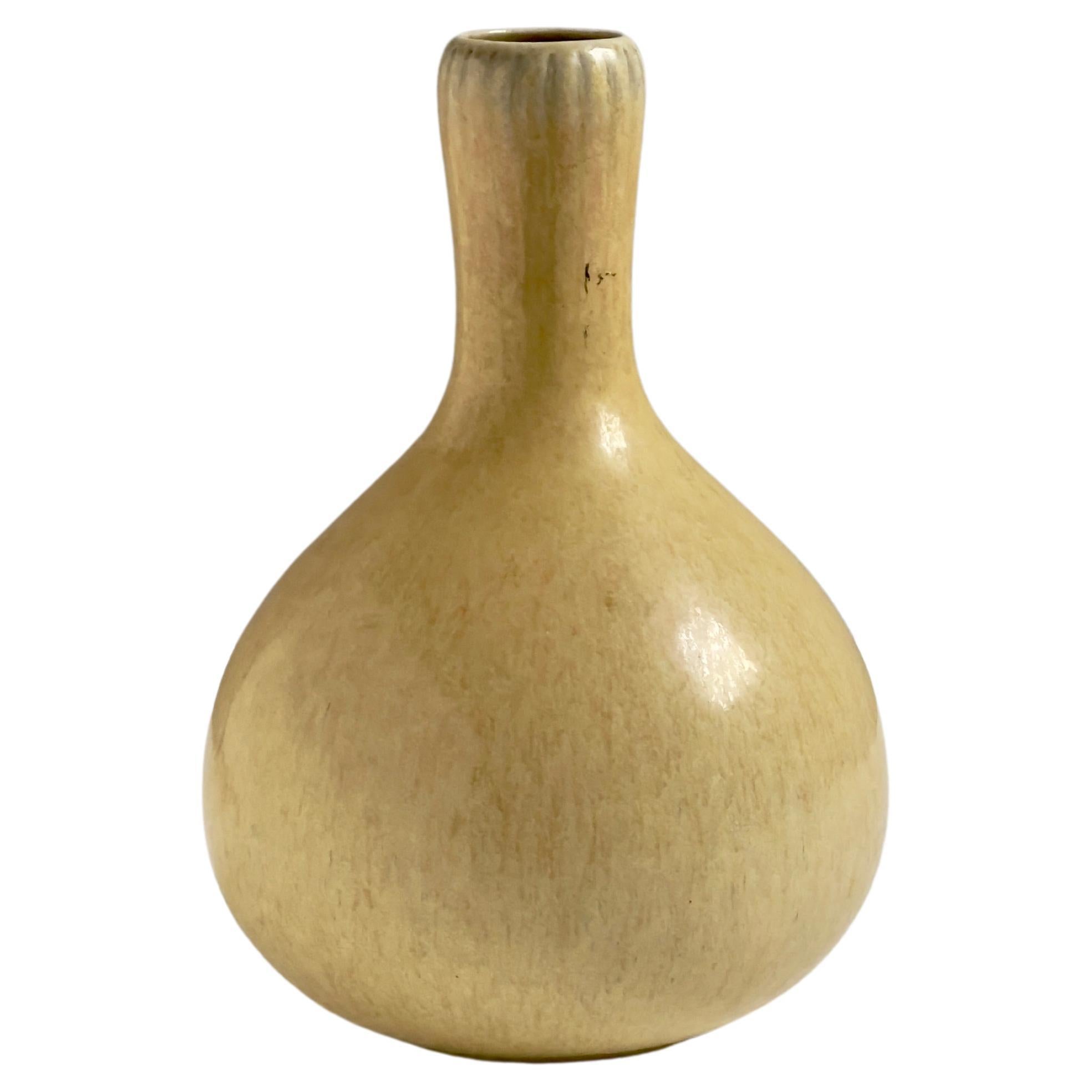Narrow long necked vase in yellow glaze by Eva Stæhr Nielsen for Saxbo, Denmark